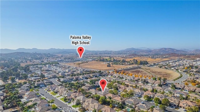 drone / aerial view with a residential view and a mountain view