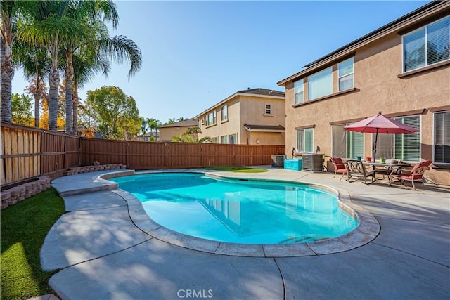 view of pool with a fenced in pool, a patio, central AC, and a fenced backyard