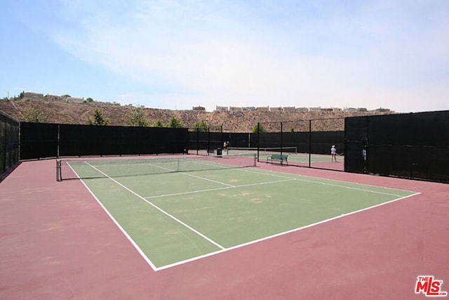 view of tennis court with basketball court