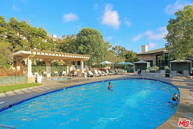 view of pool featuring a pergola and a patio