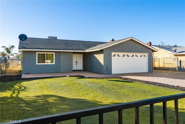 ranch-style home featuring a front yard and a garage