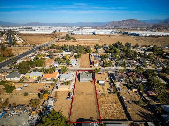 birds eye view of property with a mountain view