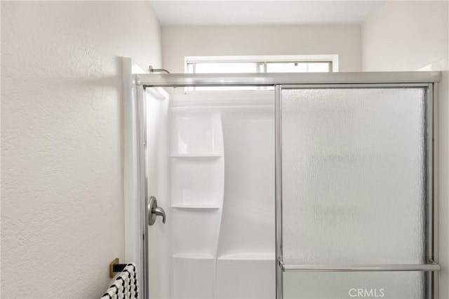 bathroom featuring walk in shower