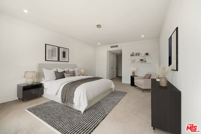 bedroom featuring light carpet