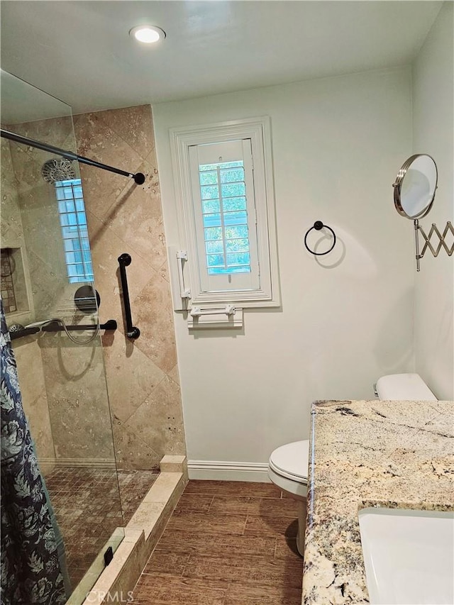 716 Avenida Majorca Unit C, Laguna Woods, CA 92637 - bathroom with a tile shower, wood finished floors, recessed lighting, and vanity