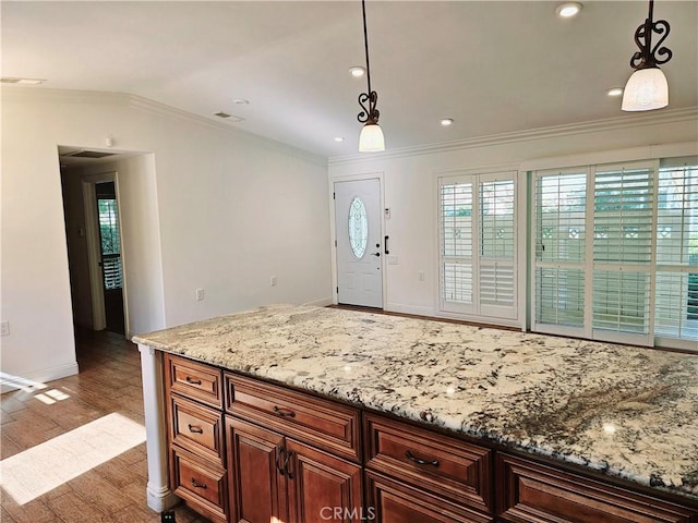 716 Avenida Majorca Unit C, Laguna Woods, CA 92637 - kitchen featuring ornamental molding, decorative light fixtures, light stone countertops, wood finished floors, and recessed lighting