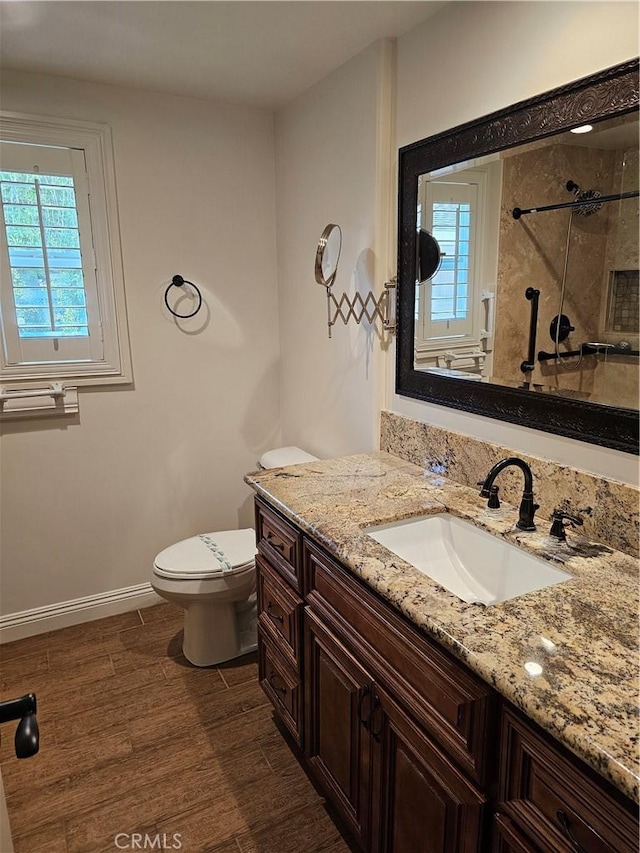 716 Avenida Majorca Unit C, Laguna Woods, CA 92637 - full bathroom with vanity, healthy amount of natural light, a tile shower, and wood finished floors