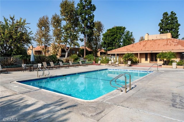 view of swimming pool with a patio area