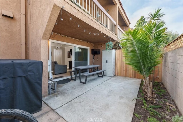 view of patio with a balcony