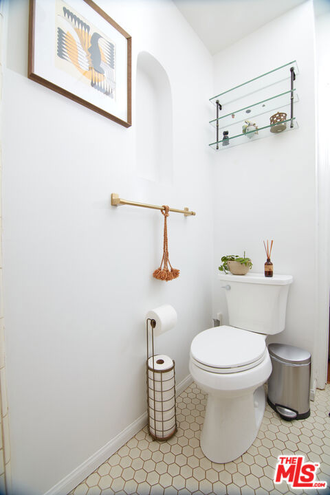 bathroom with tile patterned floors and toilet