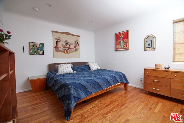 bedroom featuring light hardwood / wood-style flooring