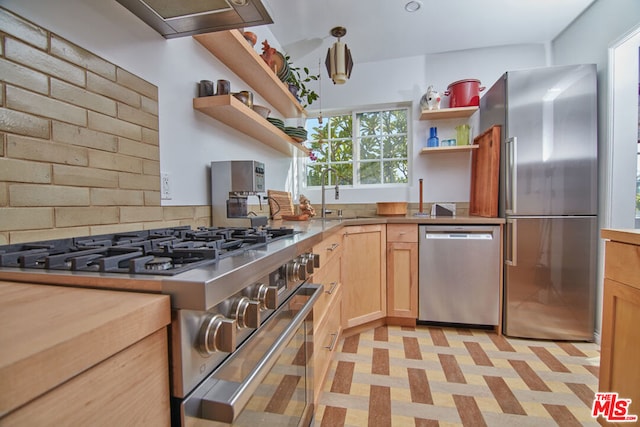 kitchen featuring decorative backsplash, sink, light brown cabinets, and stainless steel appliances