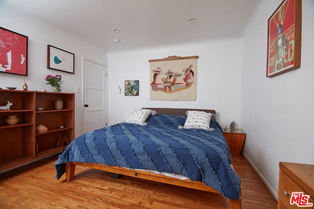 bedroom featuring hardwood / wood-style flooring