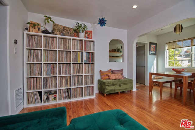 sitting room with hardwood / wood-style flooring