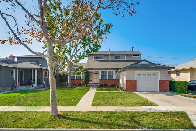 view of front of property featuring a front yard and a garage