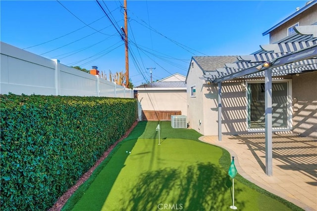 view of yard with a pergola, a patio area, and cooling unit