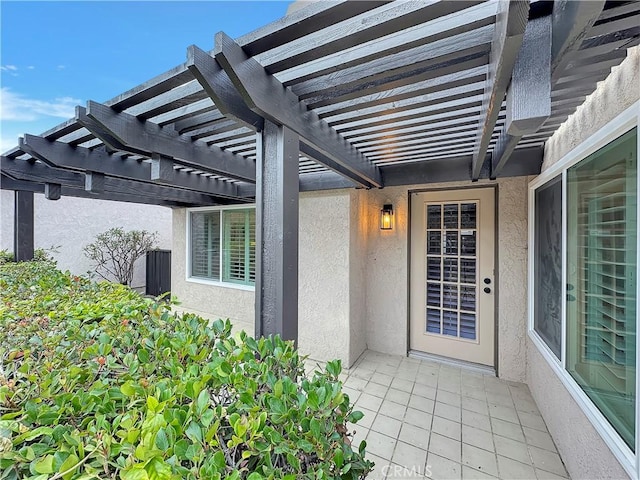 entrance to property with a pergola