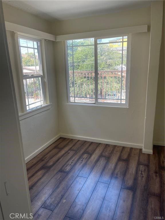 empty room featuring dark hardwood / wood-style floors