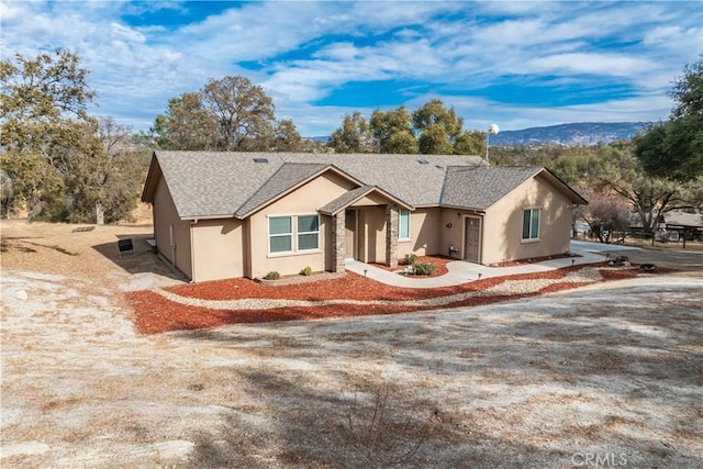 single story home featuring a mountain view