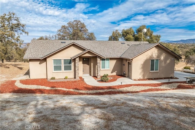 single story home featuring a mountain view