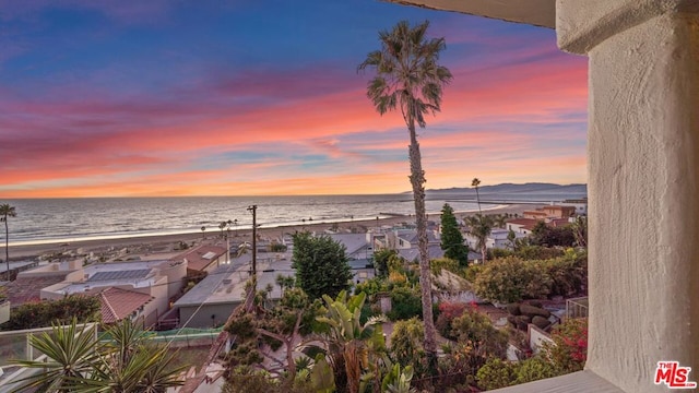 property view of water featuring a beach view