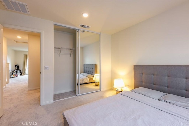 carpeted bedroom featuring a closet