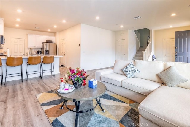 living room featuring light wood-type flooring