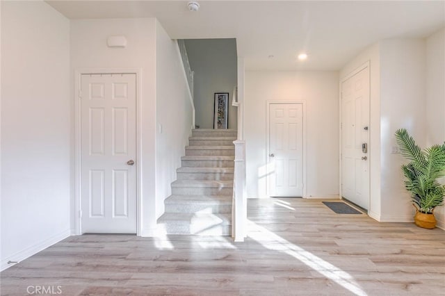 entryway with light hardwood / wood-style flooring