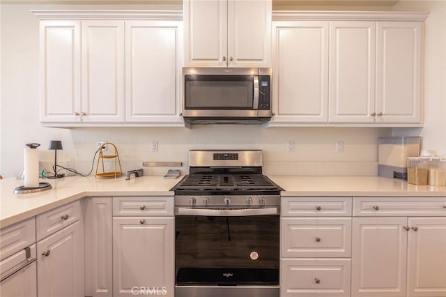 kitchen with stainless steel appliances and white cabinets