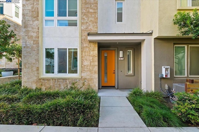 entrance to property with central AC unit