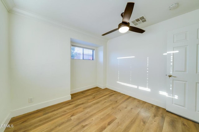 unfurnished room with light wood-type flooring, ceiling fan, and crown molding