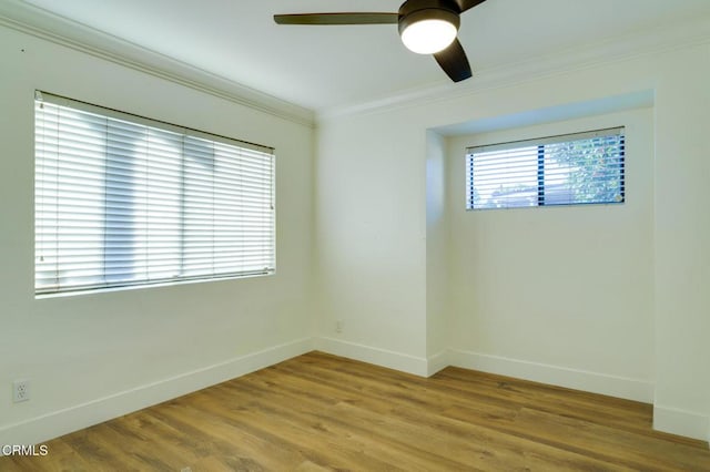 unfurnished room with ceiling fan, crown molding, and hardwood / wood-style floors