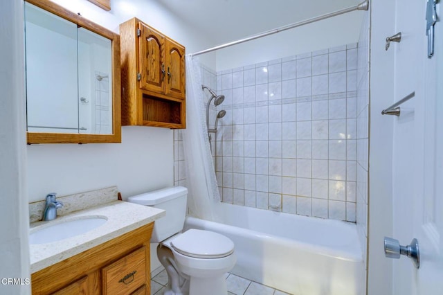 full bathroom featuring toilet, vanity, tile patterned flooring, and tiled shower / bath