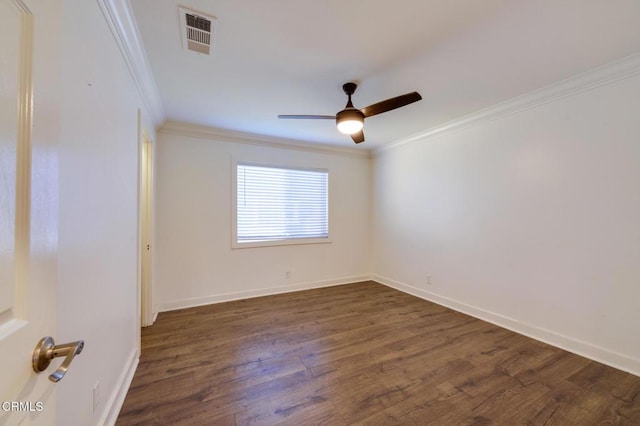 spare room featuring ceiling fan, dark hardwood / wood-style floors, and ornamental molding