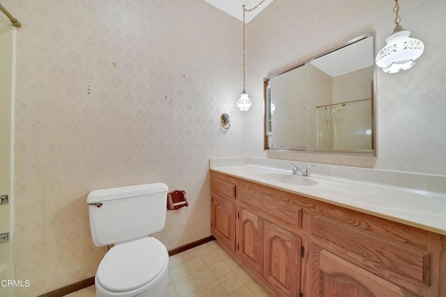 bathroom with walk in shower, vanity, and toilet