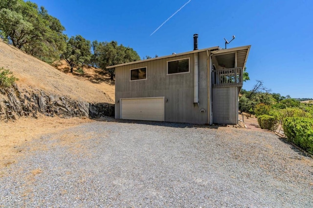 view of side of property featuring a garage