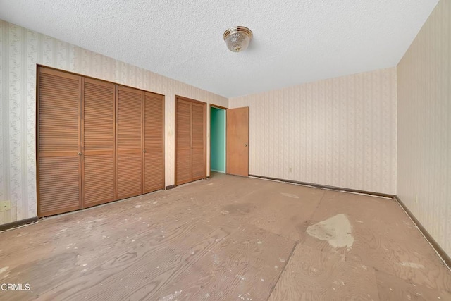 unfurnished bedroom with a textured ceiling