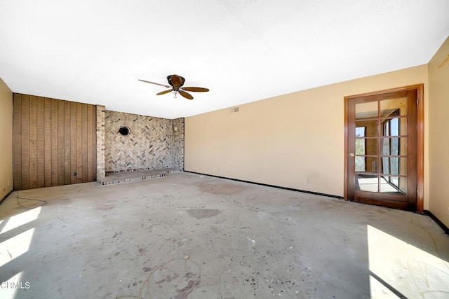 unfurnished room with ceiling fan