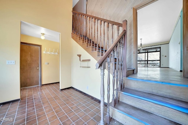 stairs with tile patterned flooring