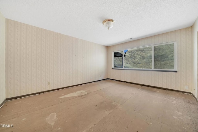 empty room featuring a textured ceiling