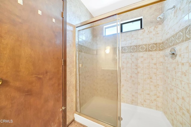 bathroom with an enclosed shower