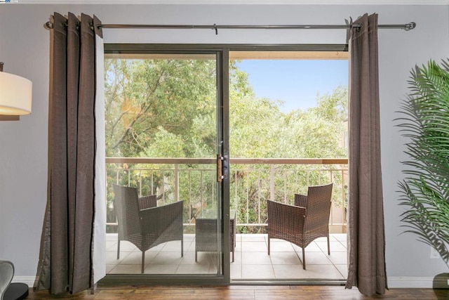 doorway with hardwood / wood-style floors