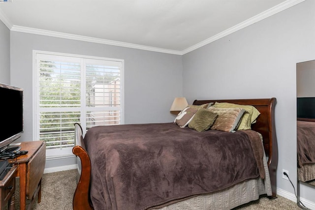 bedroom with carpet floors and crown molding