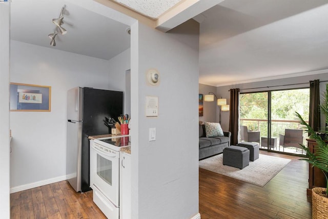 kitchen featuring white range with electric cooktop and hardwood / wood-style floors