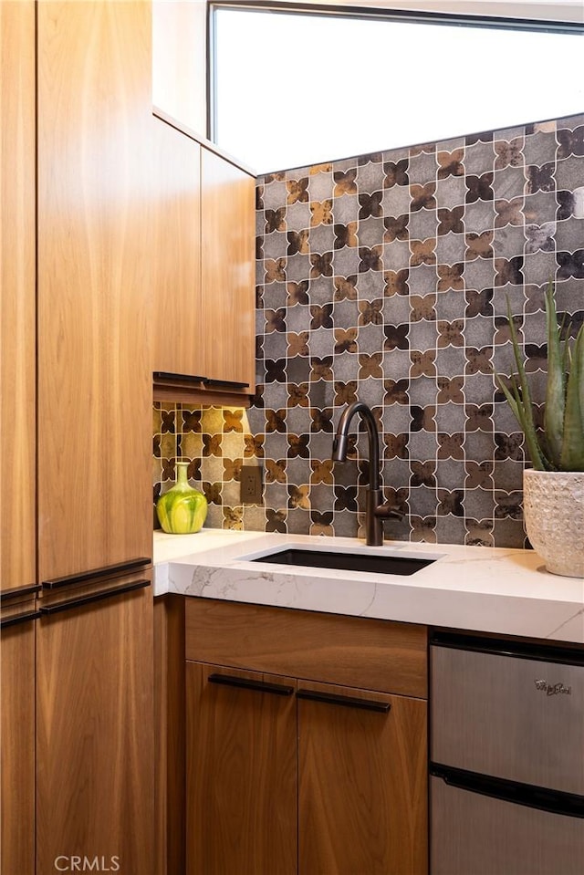 kitchen featuring backsplash and sink