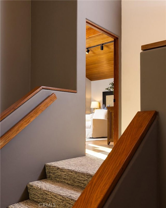 stairs with wooden ceiling