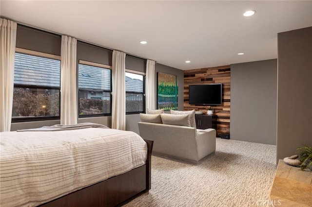 bedroom featuring wooden walls