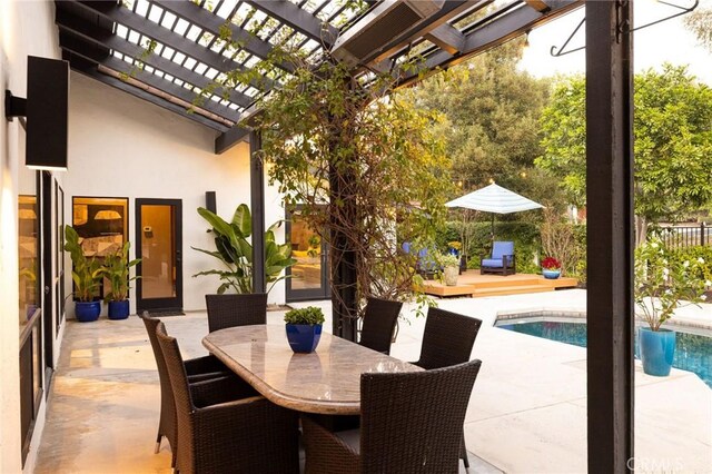 view of patio with a pergola and a swimming pool side deck