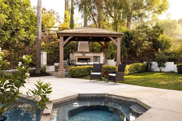 view of pool with an outdoor fireplace, a patio area, a gazebo, a yard, and an in ground hot tub