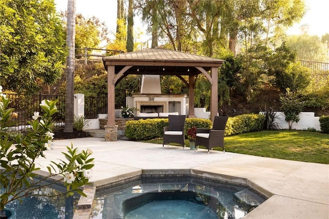 view of pool featuring a gazebo, a patio area, an outdoor fireplace, and an in ground hot tub